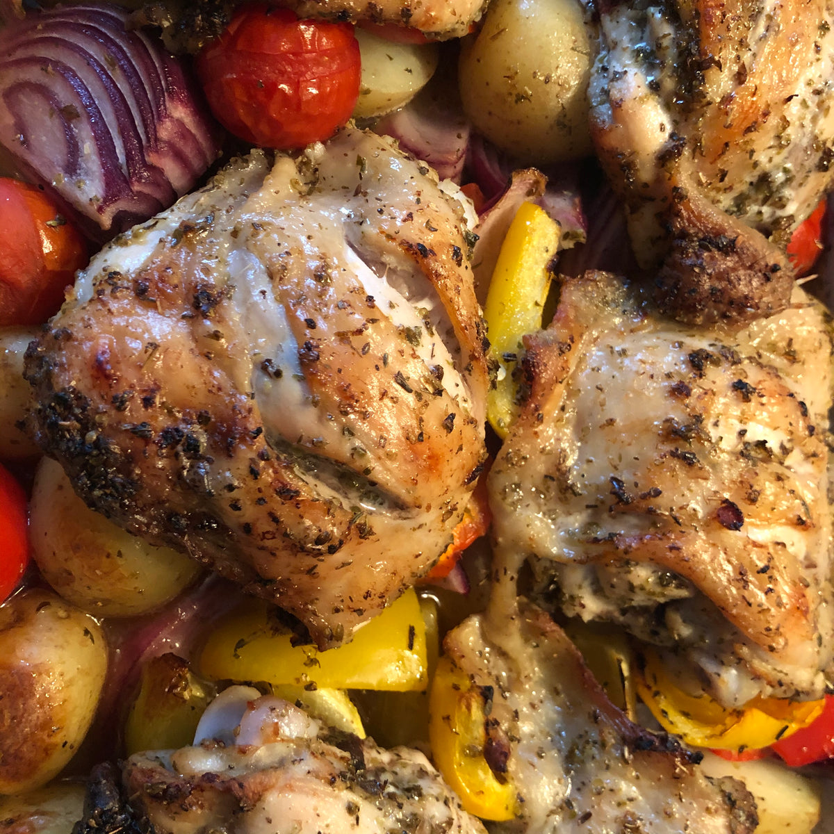 John Audsley Chicken Traybake Let the oven do the work for you in this simple and satisfying family meal.Serves 4Ingredients:8 Chicken Thighs4 tbsp Rapeseed Oil1 Lemon Juice/ finely grated Zest8 cloves of garlic peeled2 tsp of dried Oregano200g Baby New Potatoes, larger ones halfed2 Red or Yellow Peppers, roughly cut into 8 pieces2 Red Onions, sliced into chunky wedges100g Cherry Tomatoes Method:In a bowl large enough to take all of the chicken thighs, mix the oil, lemon juice and zest, and the 